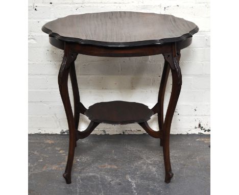 Late Victorian mahogany window table, shaped circular top with a moulded edge, carved cabriole legs joined by shelf, width 76