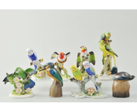 Royal Doulton model of a Parakeets, 17cm, a Doulton model of Budgerigars, another model of a Budgerigars, a Goldfinch, a Copp