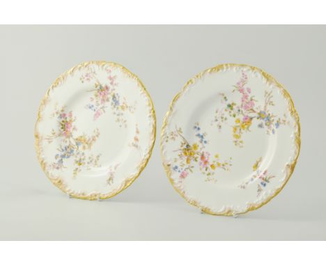 Six Royal Crown Derby dessert plates, printed in enamel floral pattern within gilt moulded scrolled borders, diameter 22cm, p