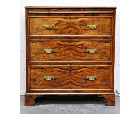 Victorian walnut bachelors chest, with frieze brushing slide, and with three graduated deep drawers below, brass bail handles
