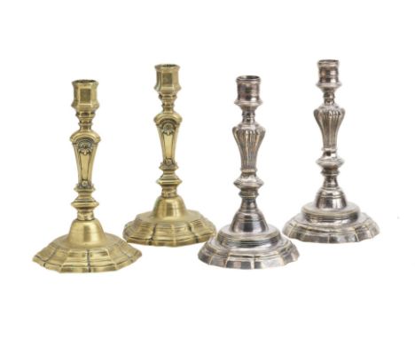Two pairs of French seamed brass candlesticksCirca 1730-40The first pair with shaped moulded base and triangular section colu