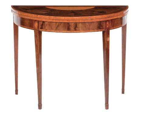 A George III mahogany and satinwood demi-lune card tableThe hinged top with green baize playing surface raised on square tape