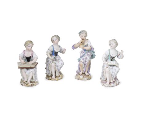 Four Meissen figures of girl musicians, late 19th centuryThree seated on rockwork, one holding a book of music, another a bun