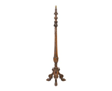 A mid 20th century carved mahogany standard lampWith single electric light, carved column raised on tripod support with hairy