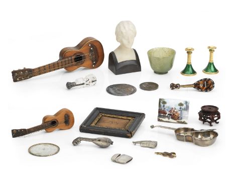 A small group of works of art and object d'art on a musical themeIncluding a pair of enamelled taper sticks, a jade cup (chip