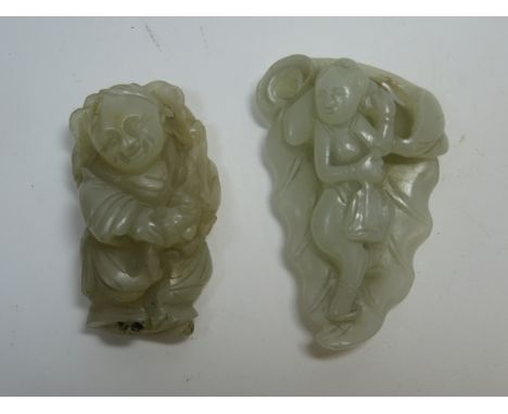Two jade carvings of boys18th/19th centuryof plae green tone, the first shown against a leaf, the second standing,6.3 and 5.2