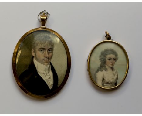 Two portrait miniaturesA Gentleman, wearing blue coat and tied white cravat, yellow metal oval frame, the rear with arranged 