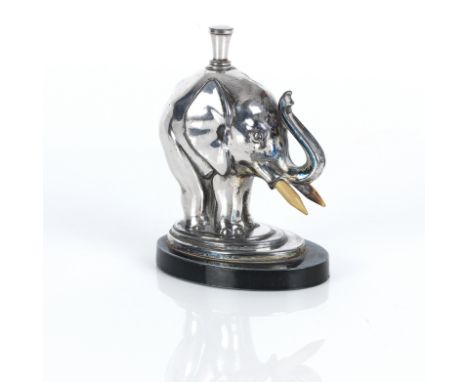 An Art Deco novelty electoplated table lighter1930s formed as an elephant with bone tusks standing on a stepped plinth, , hei