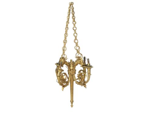 A late 19th/early 20th century giltmetal chandelierThe five lights surmounted by elaborate foliate, rams head and eagle decor