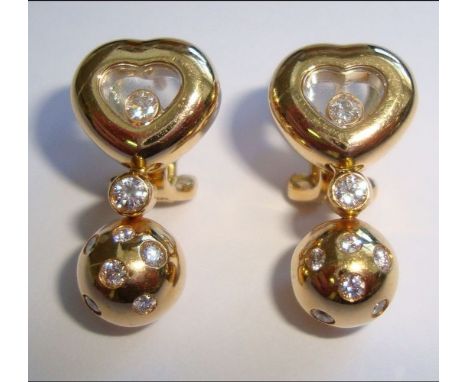 A pair of 'Happy Diamond' pendent earrings, by ChopardEach of heart design, with central glazed compartment revealing a round