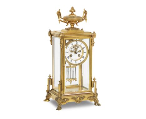 A late 19th/early 20th century ormolu four glass mantel clockThe 4-inch dial with Roman numeral, the twin train movement with