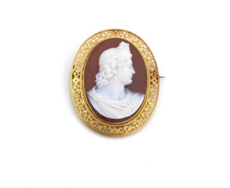 A carnelian cameo broochCarved to depict a Classical portrait profile, within a beaded and foliate scroll pierced surround, m