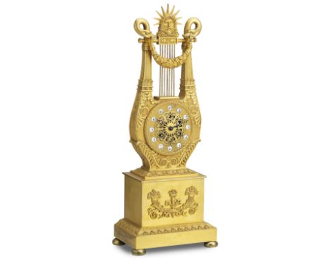 A 19th French century ormolu lyre mantel clockThe movement stamped Le Roy A ParisThe 4-inch dial with Arabic cartouche numera