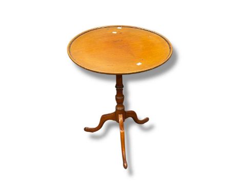 A fruitwood tripod table, 19th century, with dish top on pad feet, 70 x 56cm