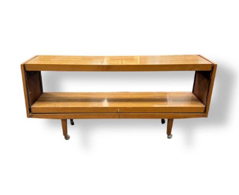 A teak veneered two tier sideboard, modern,the lower shelf raising movement currently seized73 x 159.5 x 38.5cm