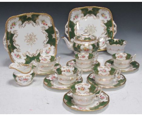 Coalport tea service with floral sprays within a green and gilded border, comprising; 'batwing' teapot, jug, sugar bowl, two 