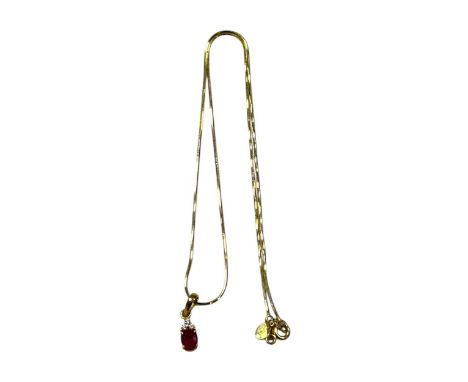 A synthetic ruby and diamond pendant and chain, unhallmarked, stamped '750' and tested as 18ct gold, gross weight 4.4g
