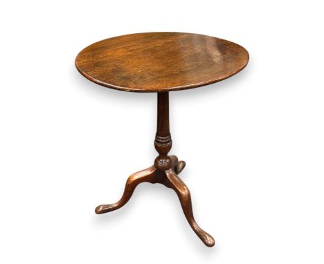 A George III mahogany tripod table,the circular tilt-top on a turned column support and pad feet68 x 59cm