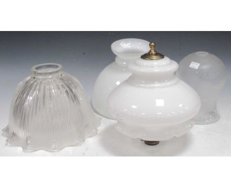 Four glass light shades, to include a moulded glass shade with ribbed body and flared scallop edge, 26cm diameter, a tulip sh