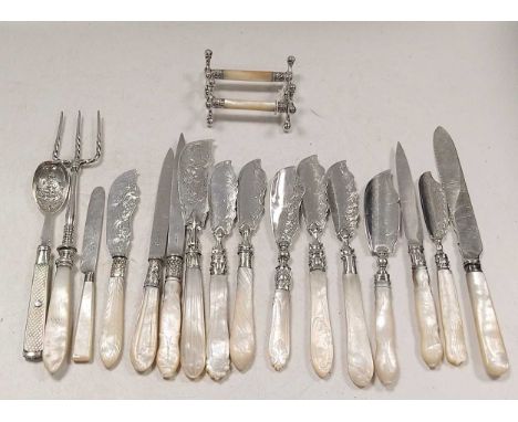 A collection of mother of pearl mounted silverware including butter knives, pickle fork, jam spoon, paper knife etc, together