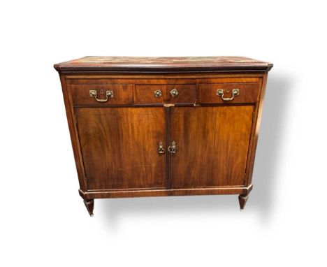 A Continental mahogany cupboard recently adapted into a drinks cabinet,the lift up top enclosing shelves and a central ice bu