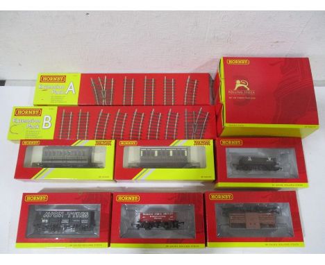 A collection of boxed and unused Hornby double O gauge rolling stock including four Plank wagon Westleigh stone &amp; Lime Co