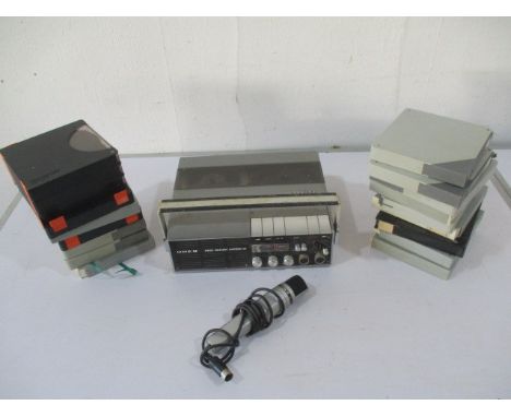 An Uher 4400 Report Stereo reel to reel recorder, along with reels.