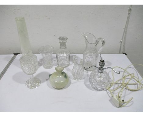 A collection of glassware including a Georgian jug, lamp base etc.
