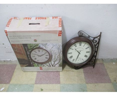 A boxed doubled sided Greenwich Station clock &amp; thermometer