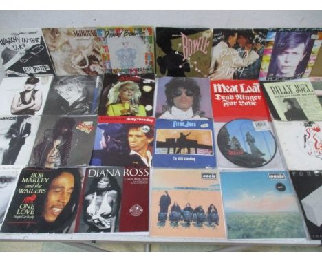 A large collection of 7" vinyl records including Elvis Presley, Queen, David Bowie, Madonna, Sex Pistols, Pretenders, Whitesn