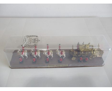 A boxed model of the Royal State Coach commemorating The Queen's Silver Jubilee