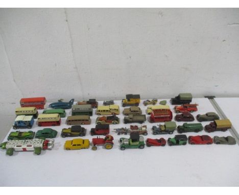  A collection of die cast model cars including Dinky, Matchbox and Lesney