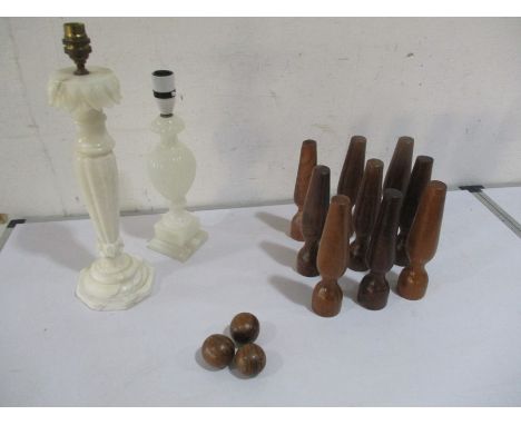 A set of miniature skittles along with one alabaster lamp base and another