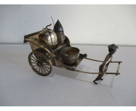 A novelty Chinese silver condiment set in the form of a rickshaw