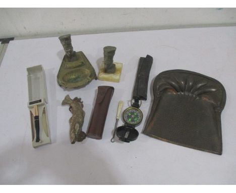 A collection of miscellaneous items including a door knocker in the form of a fish, walking engineer directional compass, ash
