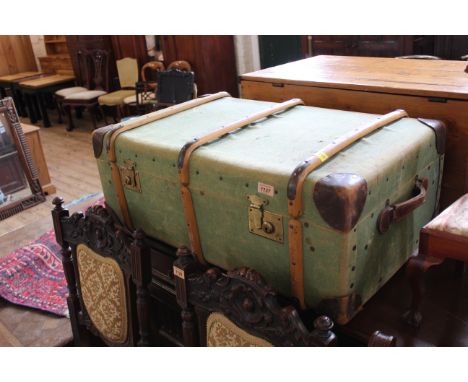 A canvas and bentwood steamer trunk