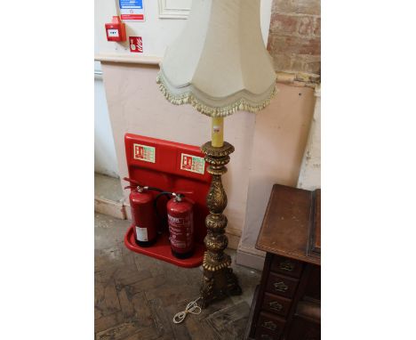 An ornate gilt standard lamp 