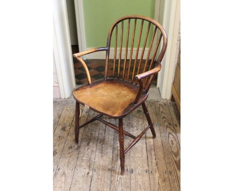 A late 19th Century beech and elm stick back armchair