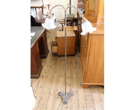 An early 20th Century brass standard lamp with two lights