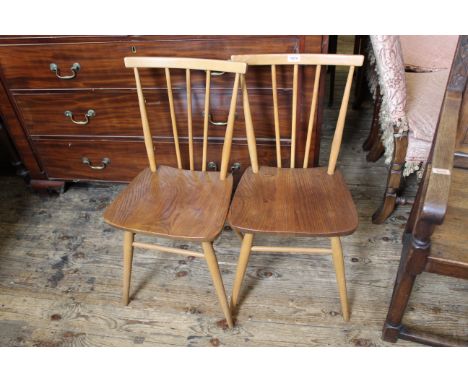 A pair of mid Century Ercol elm and beech chairs