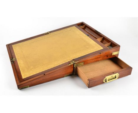 A Victorian mahogany writing slope with brass mountings, a fitted interior containing two lidded glass bottles, and a light b