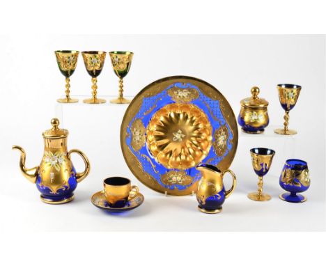 A Bohemian glass service with gilt overlay,  including two large bowls, a teapot and cups, multiple glasses, diameter of bowl