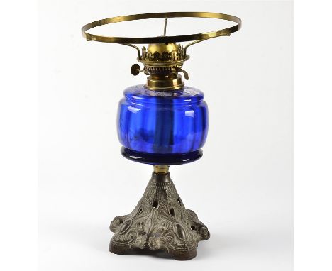 An oil lamp with blue glass reservoir,  a frosted shade and chimney, marked 'Duplex' made in England, height of base 38cm,  