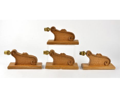Four Robert Thompson of Kilburn 'Mouseman' oak wall light brackets, rectangular mounting plate attached to an arm with carved