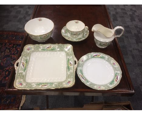 An Art Nouveau Faisian Radfordian tea service, designed by Samuel Radford, decorated with pheasants and foliage, numbered 280