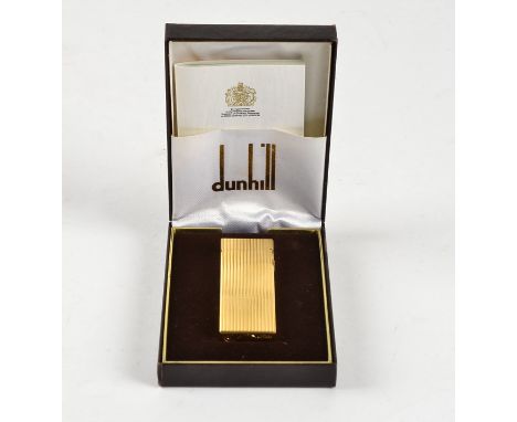 A Dunhill lighter,  in original box and sleeve, with engine turned decoration 'Rollagas XB 422'  
