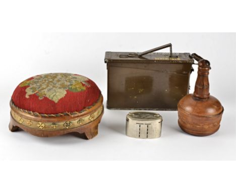 A late 19th-early 20th Century leather bound glass bottle, with stopper, height 21cm, together with a circular wooden footsta