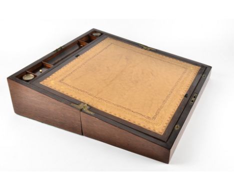 A Victorian rosewood writing slope, inlaid with mahogany panels, a fitted interior containing two lidded glass bottles and a 