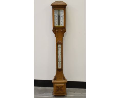 An Edwardian oak cased barometer, the segmented top with a register signed 'Pastorelli &amp; Rapkin Ltd, 46 Hatton Garden Lon