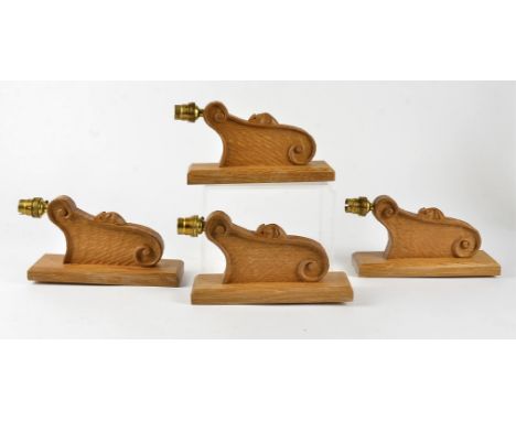 Four Robert Thompson of Kilburn 'Mouseman' oak wall light brackets, rectangular mounting plate attached to an arm with carved